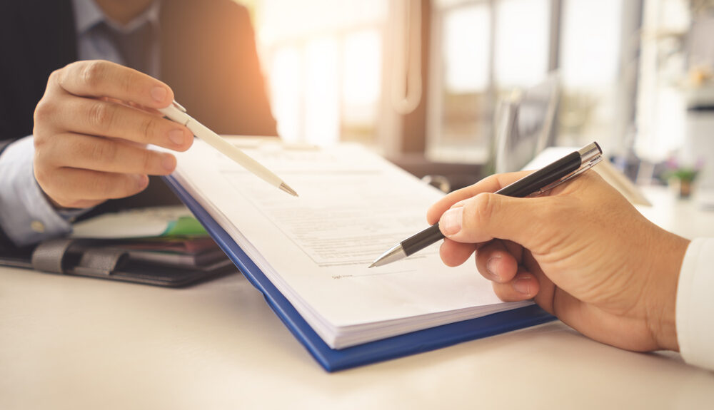 Hands,Are,Signing,Contract,Agreement.contract,Agreement,Policy,Concept. shutterstock 1110153725 1 e1639505233191