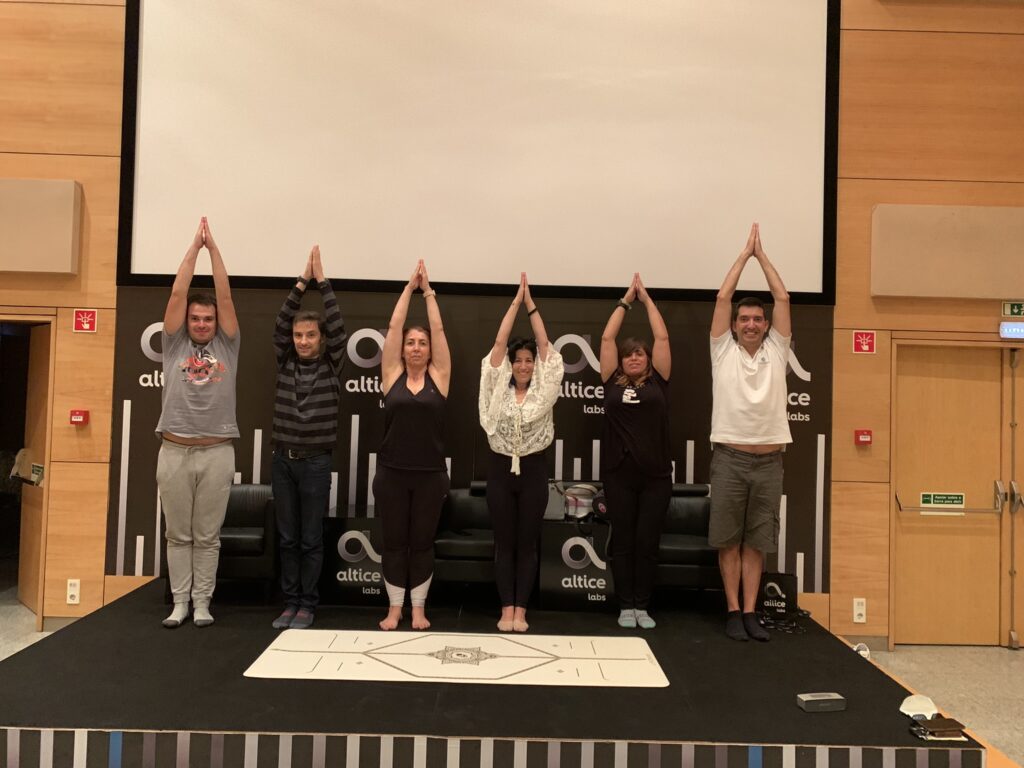 Employees participate in a Yoga Class