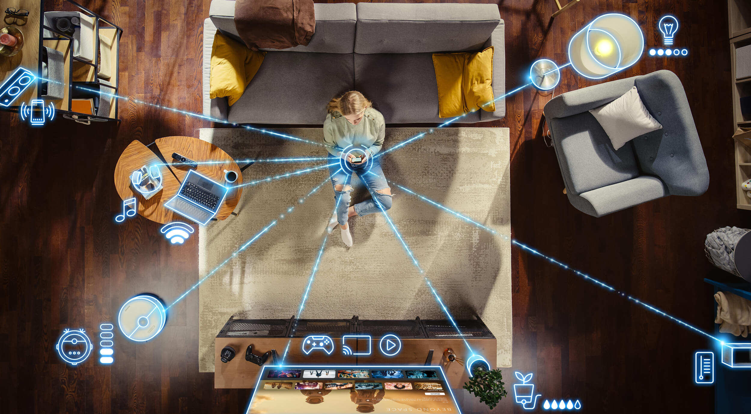 Girl sitting on the floor on a smartphone with multiple lines connected to devices.